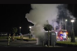 Kledingcontainer in brand op Palazzo