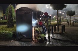 Kledingcontainer in brand op Palazzo